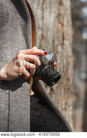 Old Vintage Camera Rangefinder In The Hands Of A Girl Who Is In The Park