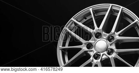 Sporty Lightweight Alloy Wheel, Spokes And Rim Close-up On A Black Background, Copy Space