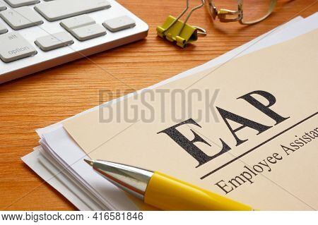 Stack Of Papers About Eap Employee Assistance Programme Or Program.