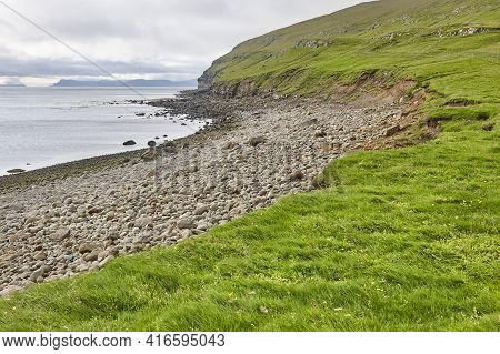 Picturesque Faroese Pebble Beach In Sandoy Island. Faroe Archipelago