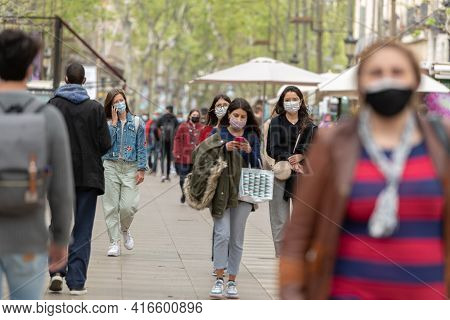 Barcelona, Catalonia: 2021 April 6: People Walk In The Ramblas In The City Of Barcelona In Time Of C
