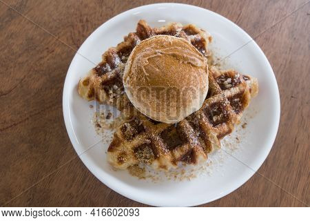 A Baked Croissant Dough In Waffle Iron With A Scoop Of Vanilla Ice Cream.