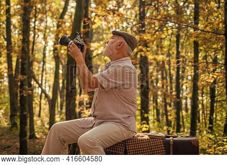 Shooting Autumn Session. Old Man Shoot In Nature. Landscape And Nature Photo Shooting. Using Handhel