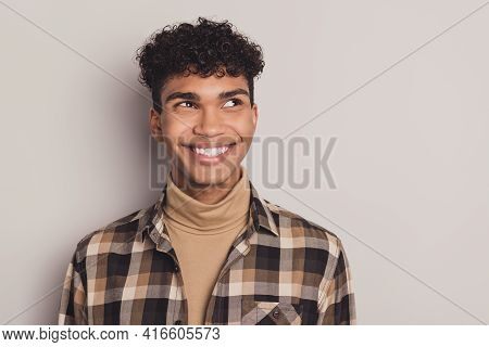 Photo Of Guy Interested Look Empty Space White Smile Wear Plaid Shirt Rollneck Isolated Grey Color B