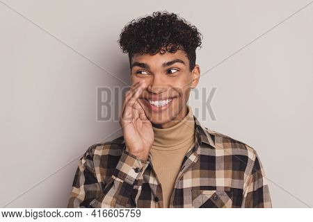 Photo Of Guy Palm Mouth Look Side Empty Space Cunning Wear Plaid Shirt Rollneck Isolated Grey Color 