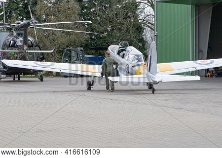 Warsaw, Poland - 04/11/2021. Male Pilot Standing Next To A Small Private Plane