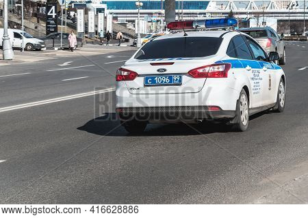 Moscow, Russia - March 2021: Police Car Drives On High Speed On The Road With Motion Blur Effect. Ba