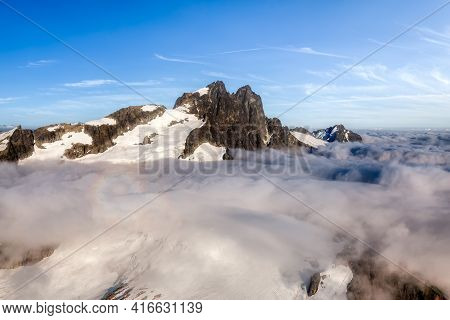 Aerial View From Airplane Of Tantalus Range Covered In Clouds. Blue Sky Art Render. Taken Near Squam
