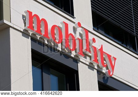 Rotkreuz, Zug, Switzerland - 28th March 2021 : Mobility Carsharing Company Sign Hanging On A Buildin
