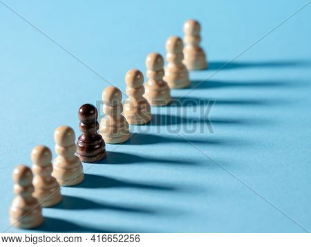 Chess Pieces In A Row, White Pawns On A Blue Background,