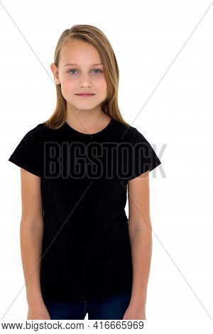 Pretty Blonde Girl In Black T-shirt. Photo Session In The Studio