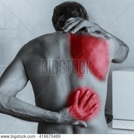 Back View Of Shirtless Man With Lower Back Pain, Black And White Photo