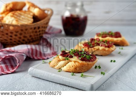 Sandwich With Sun-dried Tomatoes, Homemade Mayonnaise And Micro Greens, Served On A Board On A Gray 