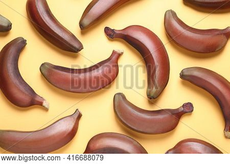 Tasty Red Baby Bananas On Yellow Background, Flat Lay