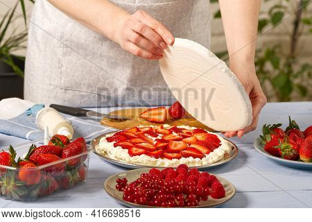 Woman Baker Add A New Layer Of Meringue Base In Strawberry Cake. Homemade Strawberries Cake Made Fro