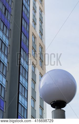 Glass Building High And Ball Street Lamp
