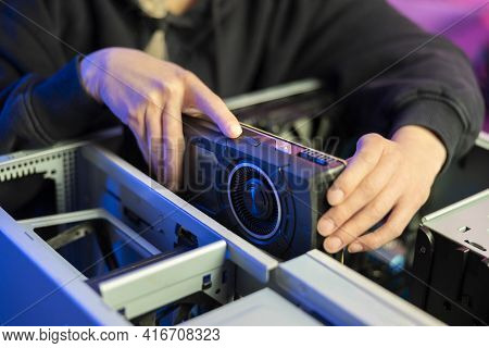Close-up Of Gamer Girl Installing New Gpu Video Card In Her Gaming Pc