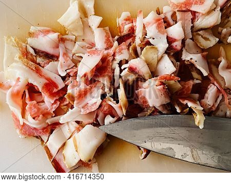 Guanciale Cut Into Small Pieces To Season The Carbonara Pasta. Typical Italian Food. Pork Cheek. Mea
