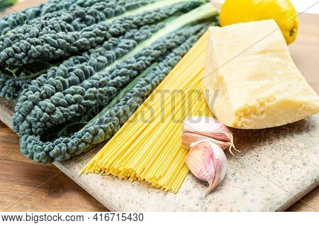 Cooking With Black Flat Leaves Of Cavolo Nero Tuscan Cabbage