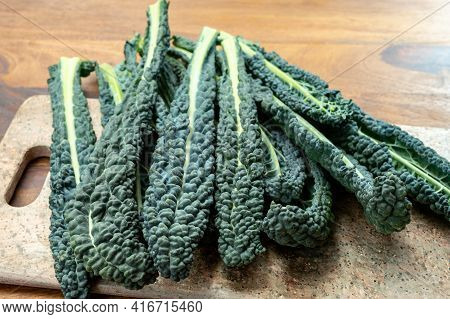 Cooking With Black Flat Leaves Of Cavolo Nero Tuscan Cabbage