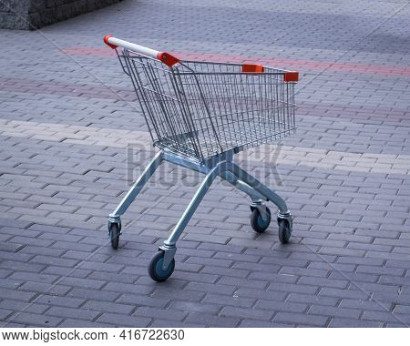Shopping Cart Alone On The Street. Quality Photo