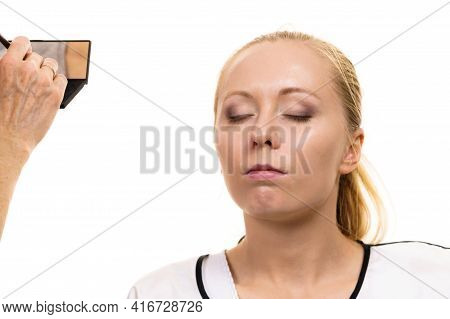 Two Women, Face Painting. Makeup Artist Applying Make Up To Model Face. Cosmetic Beauty Procedures, 