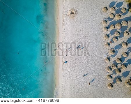Eagle Beach Aruba, Palm Trees On The Shoreline Of Eagle Beach In Aruba, Drone View At A Beach With P