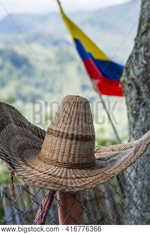 Traditional Colombian Hat With The Colombian Flag And The Mountains As A Background