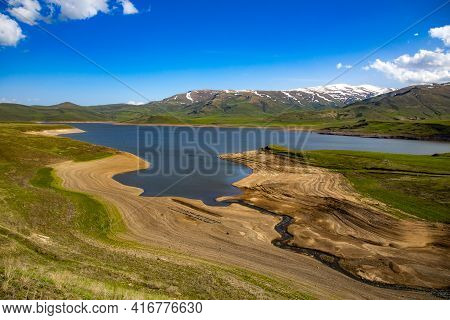 Spandaryan Reservoir In Armenia Under Blue Sky Background