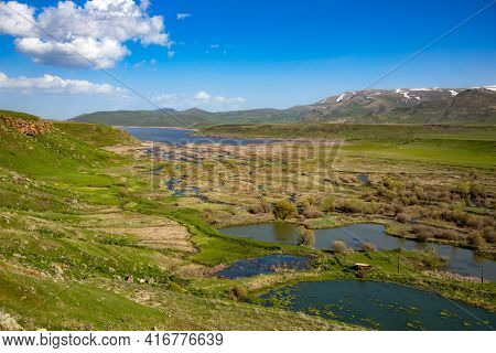 Spandaryan Reservoir In Armenia Under Blue Sky Background
