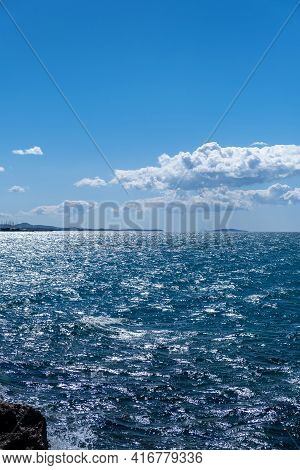 Blue Sea And Sky Background, Blue Shades And White Clouds.