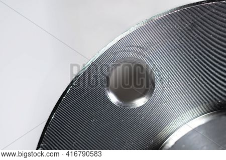 A Close-up Of A Steel Car Hub Flange. Very Shallow Depth Of Field With Focus On Only A Small Portion
