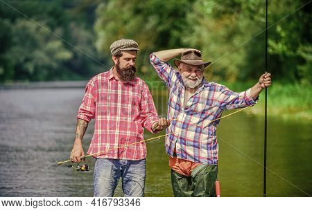 Master Baiter. Mature Man With Friend Fishing. Summer Vacation. Happy Cheerful People. Fisherman Wit
