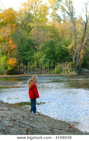 Girl On Riverbank