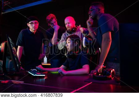 The Esports Coach Watches The Game Of An Asian Girl And Explains To The Team What To Do