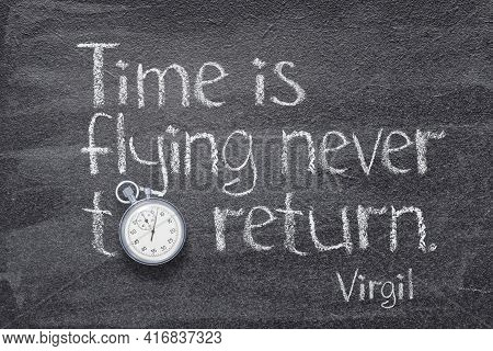 Time Is Flying Never To Return - Quote Of Ancient Roman Poet Virgil Written On Chalkboard With Vinta
