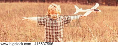 Child Playing With Toy Airplane. Happy Child Playing. Happy Child Playing Outdoors. Happy Boy Play A