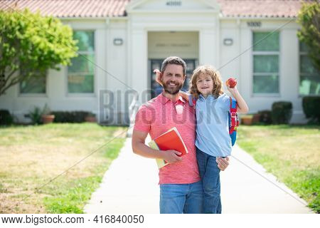 Father Supports And Motivates Son. Kid Going To Primary School. Father Walking To School With Child