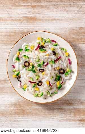 Vegan Konjac Pasta With Broccoli, Olives, And Onions, Shot From Above