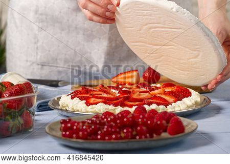 Woman Baker Add A New Layer Of Meringue Base In Strawberry Cake. Homemade Strawberries Cake Made Fro