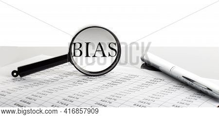 Magnifying Glass With Text Bias On The Chart Background With Pen