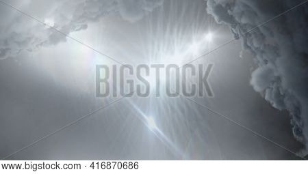 Clouds over grey sky and stadium lighting background. sports and events background, digitally generated image.