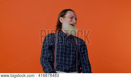 Happy Joyful Senior Old Bearded Gray-haired Man Laughing Out Loud After Hearing Ridiculous Anecdote,