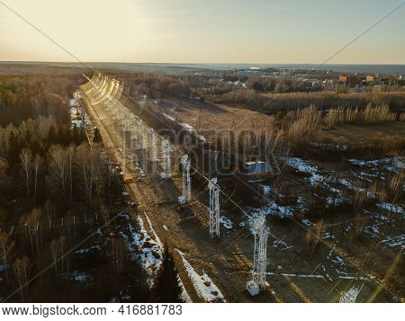Antenna Array. A Long Row Of Radio Telescopic Antennas At The Sunset