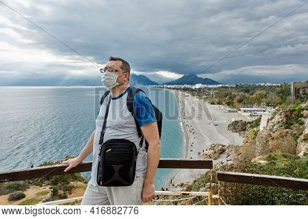 Deserted Beach In Antalya Turkey, European Tourist Is Wearing Protective Face Mask.