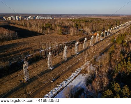 Antenna Array. A Long Row Of Radio Telescopic Antennas At The Sunset