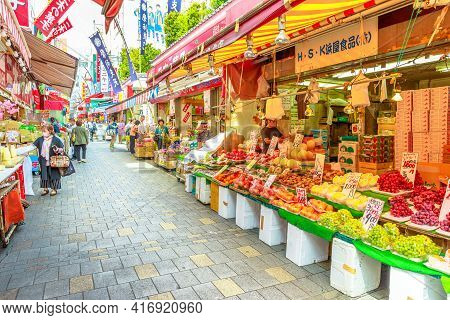 Tokyo, Japan - April 18, 2017: Fruit, Fish And Japanese Produce Stalls Along Popular Market Ameya-yo