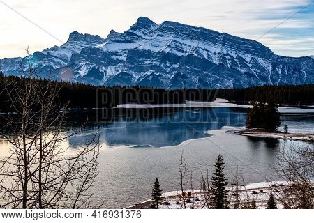 Rundle Mountain As Seen From A Partialy Iced Over Two Jack Lake. Banff National Park. Alberta, Canad