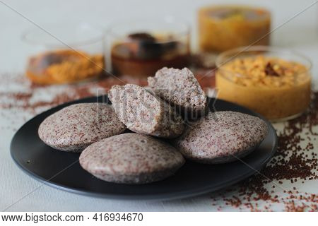Steamed Cakes Made With Finger Millets And Skinned Black Gram. Locally Known As Ragi Idli. Served Al