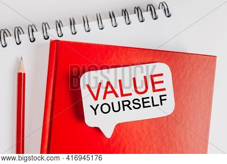 Text Value Yourself On A White Sticker With Office Stationery Background. Flat Lay On Business, Fina